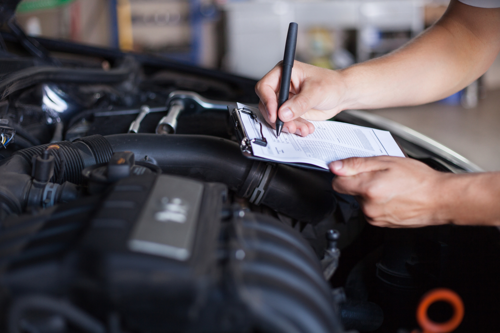 Mechanic,repairman,inspecting,car
